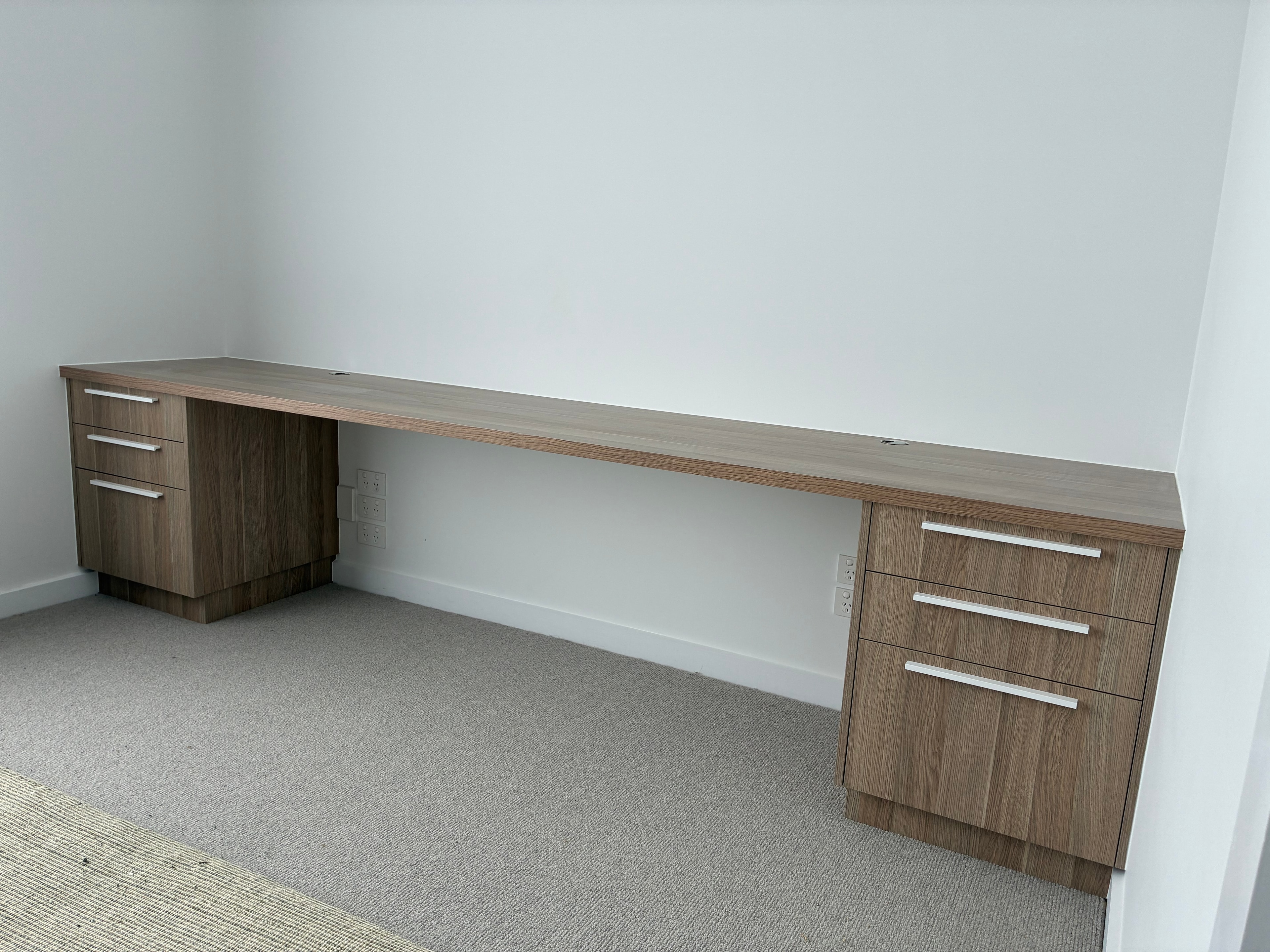 Custom timber veneer floating desk with drawer pedestals and cable management, Pelican Waters